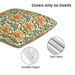 Hidden zipper and velvet detail on a pillow cover with orange and teal floral damask on cream