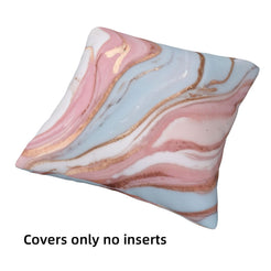 Single short-pile plush pillow cover with blush, blue and rose marble designs, shown without an insert