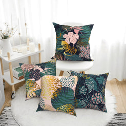 Short-pile plush pillow covers with dark tropical leaves and leopard spots, styled in a bright room