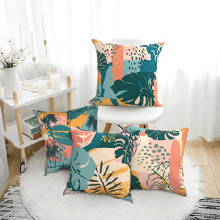 Short-pile plush pillow covers with coral, teal and mustard tropical leaves, styled in a bright room