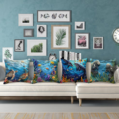 Coastal short-pile plush pillow covers with sea turtles, tropical fish, whales and manatees, styled on a white sofa