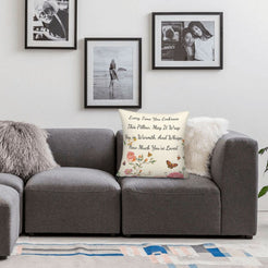 Velvet pillow cover with cream floral pattern and heartfelt love quote, styled on a sofa