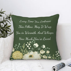 Velvet pillow cover with dark green floral pattern and heartfelt love quote, styled by a window
