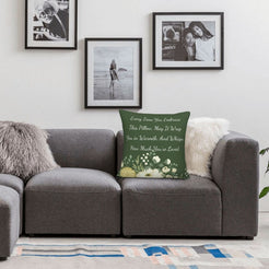 Velvet pillow cover with dark green floral pattern and heartfelt love quote, styled on a sofa