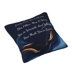 Angled view of a velvet pillow cover with navy blue marble pattern and heartfelt love quote