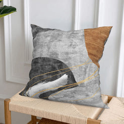Short-pile plush pillow covers with gray, brown and black abstract curves, styled on a woven chair