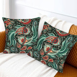 Red and teal paisley velvet pillow covers styled on a white sofa