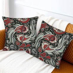 Velvet pillow covers with gray, red and teal paisley, styled on a white sofa
