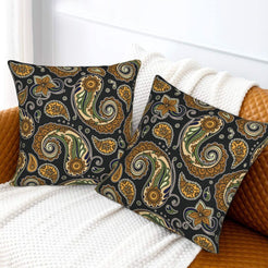 Velvet pillow covers with small ochre paisley, styled on a white sofa