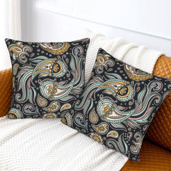 Velvet pillow covers with gray and ochre paisley, styled on a white sofa