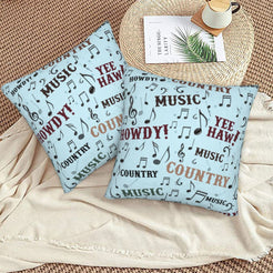 Western velvet pillow covers with light blue country music typography, styled on a woven chair