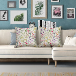 Water-resistant pillow covers with cream delicate wildflower stems, styled on a white sofa