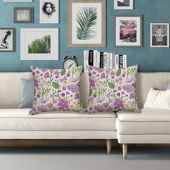 Water-resistant pillow covers with cream purple wildflowers, styled on a white sofa