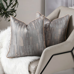 Taupe and gray abstract jacquard pillow covers styled on a sofa
