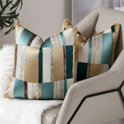 Teal, beige and brown patchwork jacquard pillow covers styled on an armchair
