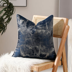 Navy blue abstract jacquard pillow covers styled on a chair