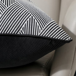 Close-up of black and white herringbone jacquard fabric with hidden zipper