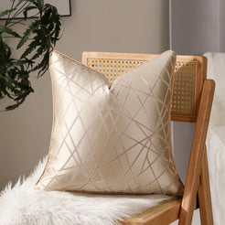 Beige geometric line jacquard pillow covers styled on a chair