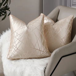 Beige geometric line jacquard pillow covers styled on an armchair