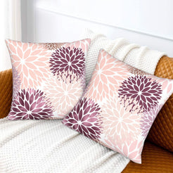 Blush and plum dahlia pattern velvet pillow covers styled on a sofa