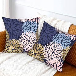 Navy, blush and gold dahlia pattern velvet pillow covers styled on a sofa