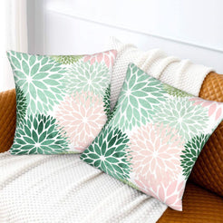 Mint, green and blush dahlia pattern velvet pillow covers styled on a sofa