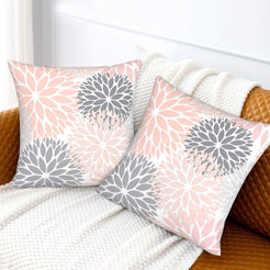 Blush and gray dahlia pattern velvet pillow covers styled on a sofa