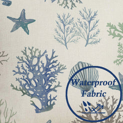 Water beads on the printed surface on water-resistant linen-look polyester pillow cover with blue coral and starfish