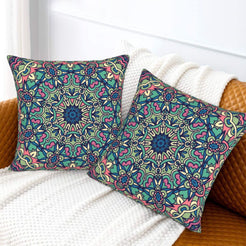 Teal and purple lace mandala design velvet pillow covers styled on a sofa