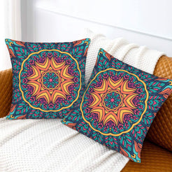Teal and orange sun mandala design velvet pillow covers styled on a sofa