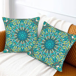 Turquoise and lime radial mandala design velvet pillow covers styled on a sofa