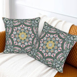 Charcoal and pink botanical mandala design velvet pillow covers styled on a sofa