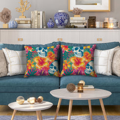 Water-resistant pillow covers with white skulls and bright hibiscus, styled on a blue sofa