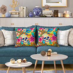 Water-resistant pillow covers with multicolor skulls and tropical flowers, styled on a blue sofa