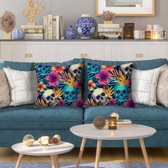 Water-resistant pillow covers with multicolor skulls, palm leaves and flowers, styled on a blue sofa