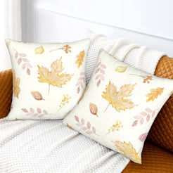 Autumn velvet pillow covers with cream gold maple leaves, styled on a sofa