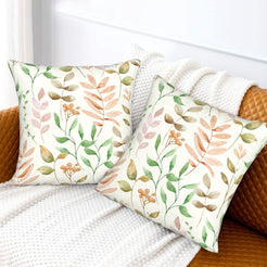 Autumn velvet pillow covers with cream pastel leafy branches, styled on a sofa