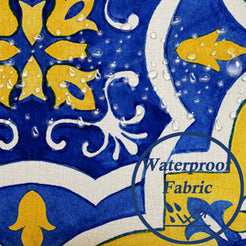 Close-up of water beads on fabric on water-resistant linen-look polyester pillow cover with yellow and blue Moroccan tiles