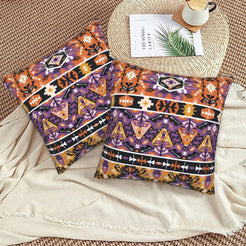 Bohemian velvet pillow covers with purple and orange tribal bands, styled on a floor cushion
