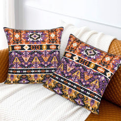 Bohemian velvet pillow covers with purple and orange tribal bands, styled on a bed