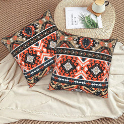 Bohemian velvet pillow covers with black and red Aztec diamonds, styled on a floor cushion