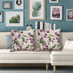 Outdoor water-resistant linen-look polyester pillow covers with birds and purple berries, styled on a white sofa