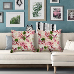 Outdoor water-resistant linen-look polyester pillow covers with burgundy roses, styled on a white sofa