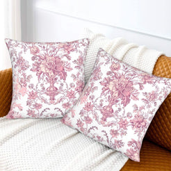 Pink toile velvet pillow covers with pink ornate floral bouquets on white, styled on a sofa