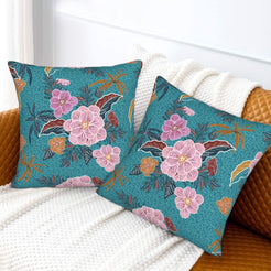 Bohemian floral velvet pillow covers with teal pink flowers, styled on a sofa