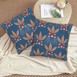 Bohemian floral velvet pillow covers with navy small red flowers, styled on a woven chair