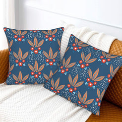 Bohemian floral velvet pillow covers with navy small red flowers, styled on a sofa