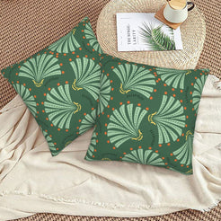 Bohemian floral velvet pillow covers with green fan leaves, styled on a woven chair