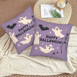 Halloween pillow covers with purple ghosts and skeleton with a Happy Halloween message, styled on a woven chair