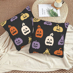 Halloween pillow covers with black colorful jack-o-lanterns, styled on a woven chair